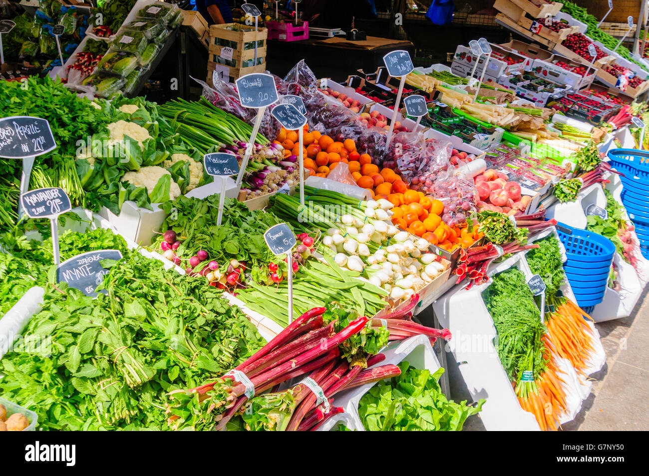 Salad vegetables, cauliflower and herbs for sale at a Danish market stall. Stock Photo