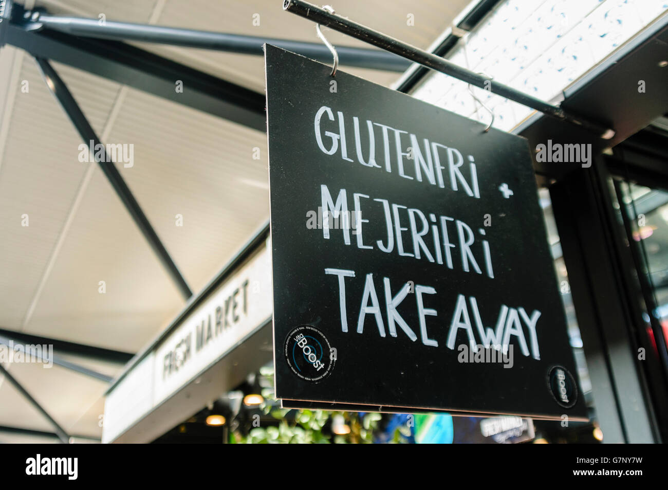 Sign at a Danish delicatessen advertising gluten and dairy free food for sale. Stock Photo