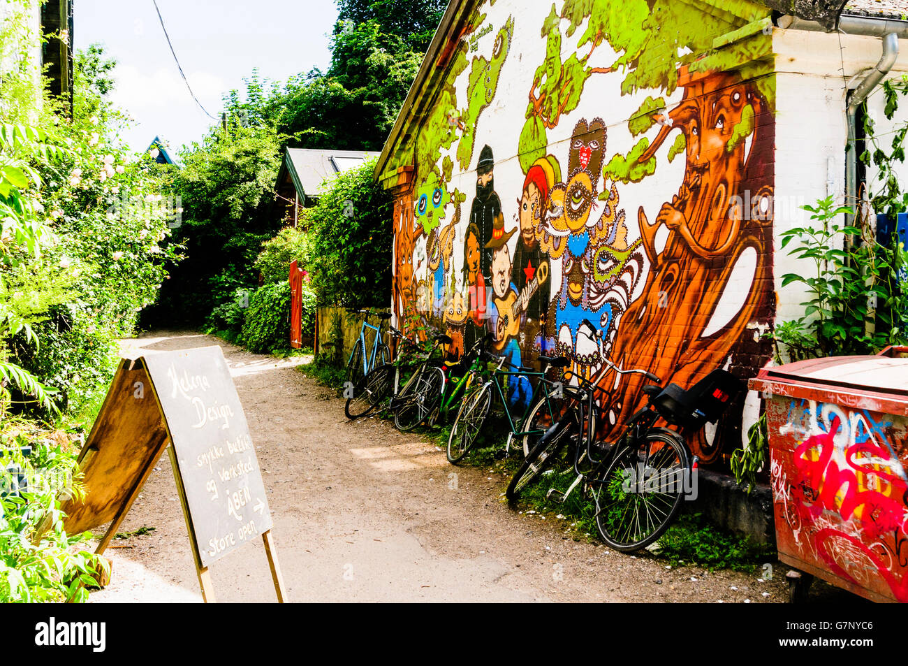 Mural on a wall along a path in Freetown Christiania, Copenhagen Stock Photo