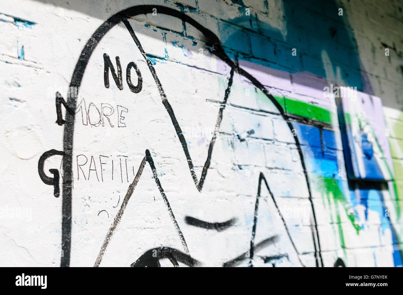 Message on a wall saying 'No more grafitti [sic]' Stock Photo