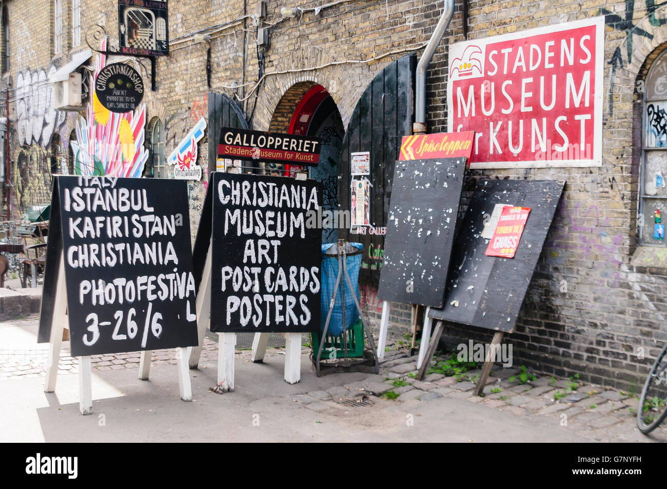 Signs outside the museum, tourist centre and shops in Freetown Christiania, Copenhagen Stock Photo