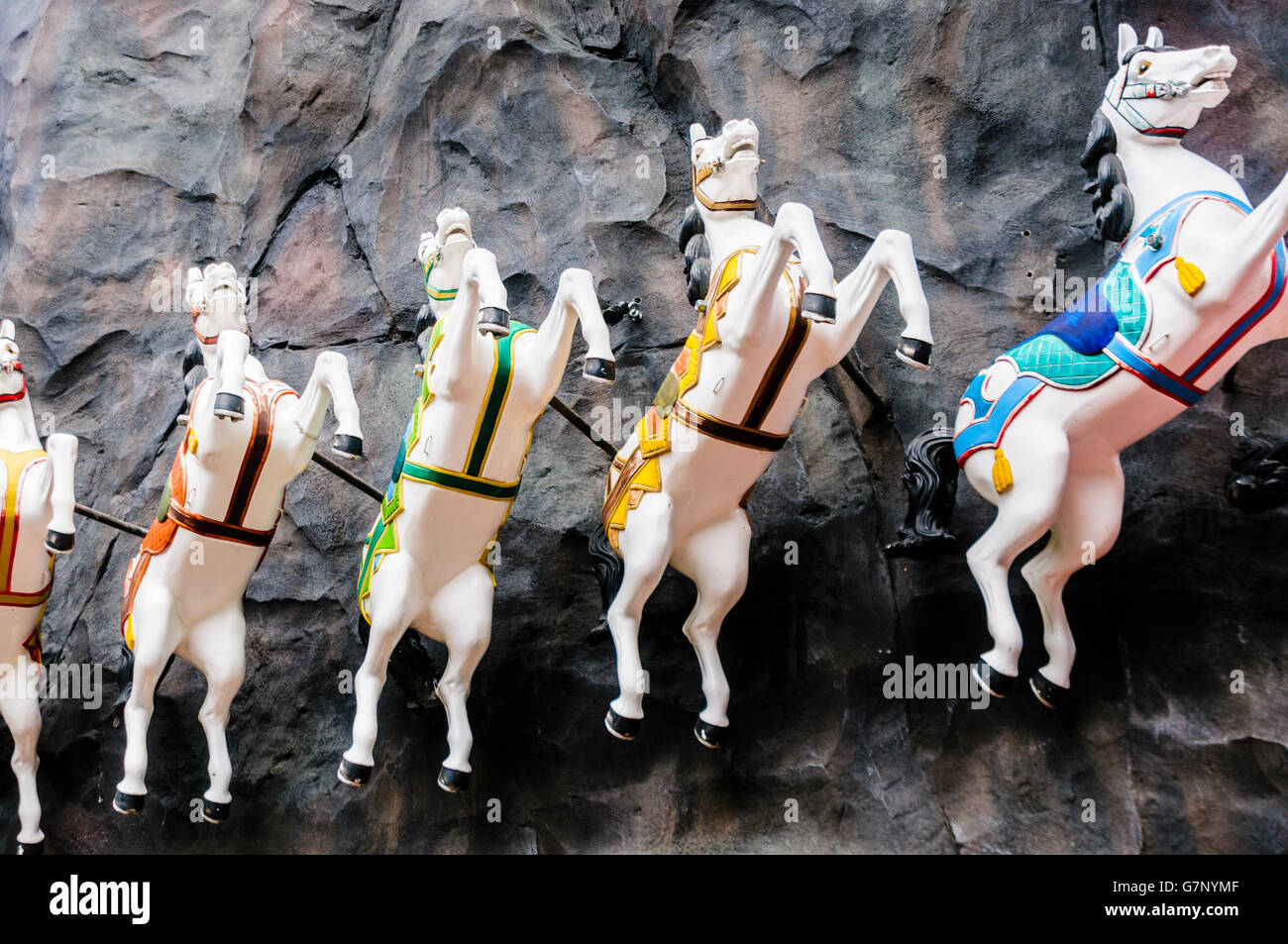 Carousel horses on display in Tivoli Garden amusement park and pleasure garden in Copenhagen, Denmark. Stock Photo