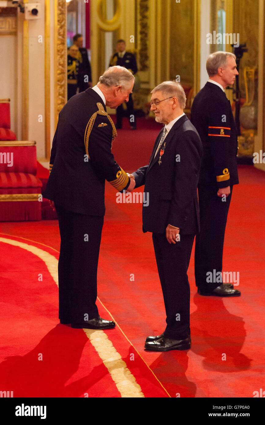 Professor Peter Holman from Colchester is made an Member of the Order of the British Empire (MBE) by the Prince of Wales during an investiture ceremony at Buckingham Palace, London. Stock Photo