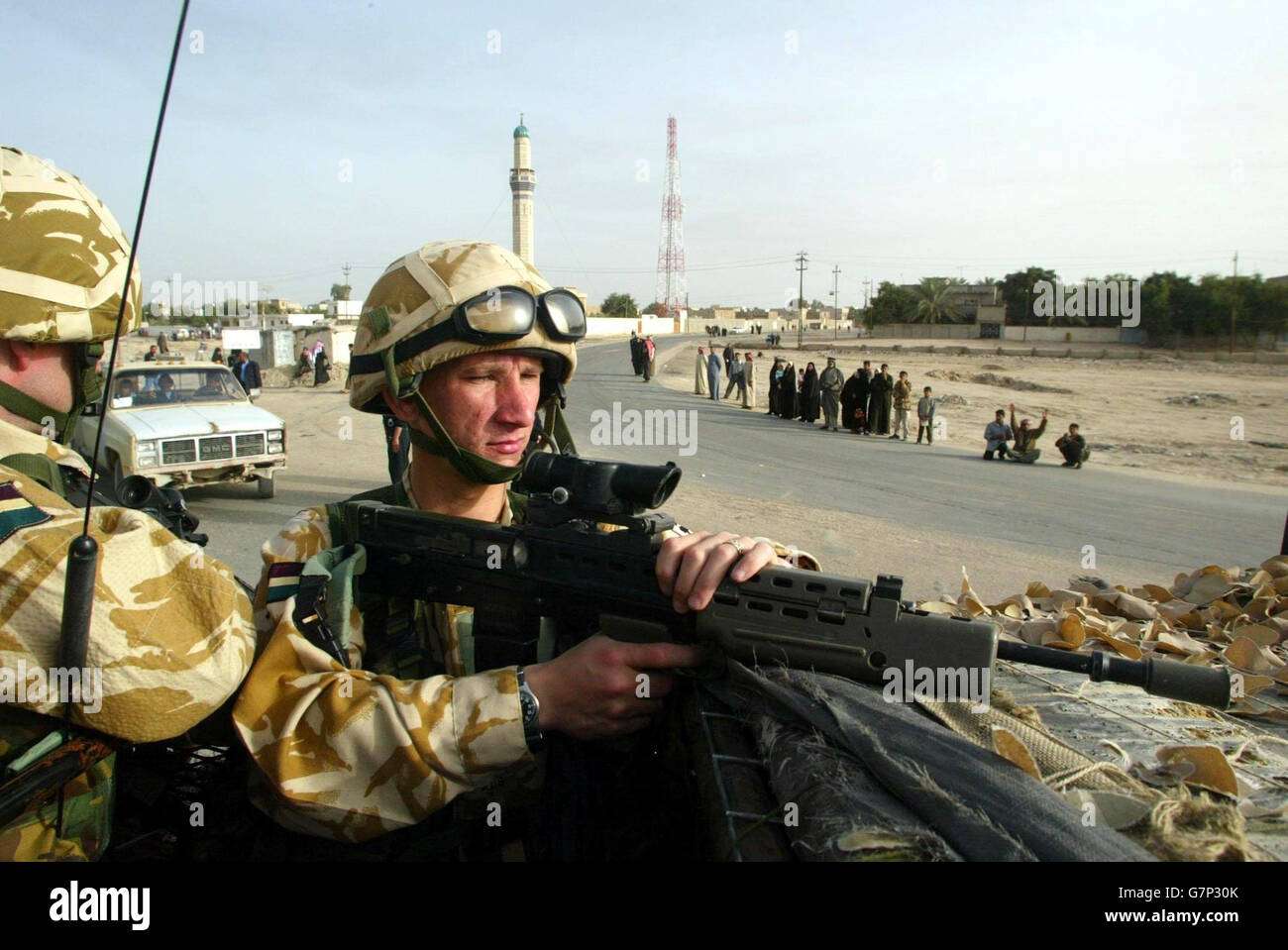 Soldiers from Royal Dragoon guards drive around Az Zubayr. Stock Photo