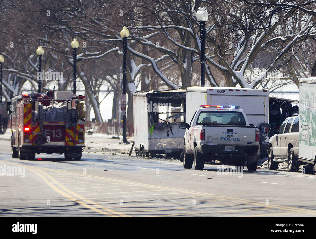 Police and fire vehicles are seen along 15th street NW near the White House, near a vendor cart that caught on fire Saturday, March 7, 2015 in Washington. Secret Service spokesman Brian Leary says a vendor cart caught fire around 10 a.m. at 15th and G streets. He says firefighters responded and contained the blaze. The fire delayed the departure of President Barack Obama and the first family who are traveling to Selma, Ala., to help commemorate the 50th anniversary of 'Bloody Sunday.' (AP Photo/Pablo Martinez Monsivais) Stock Photo