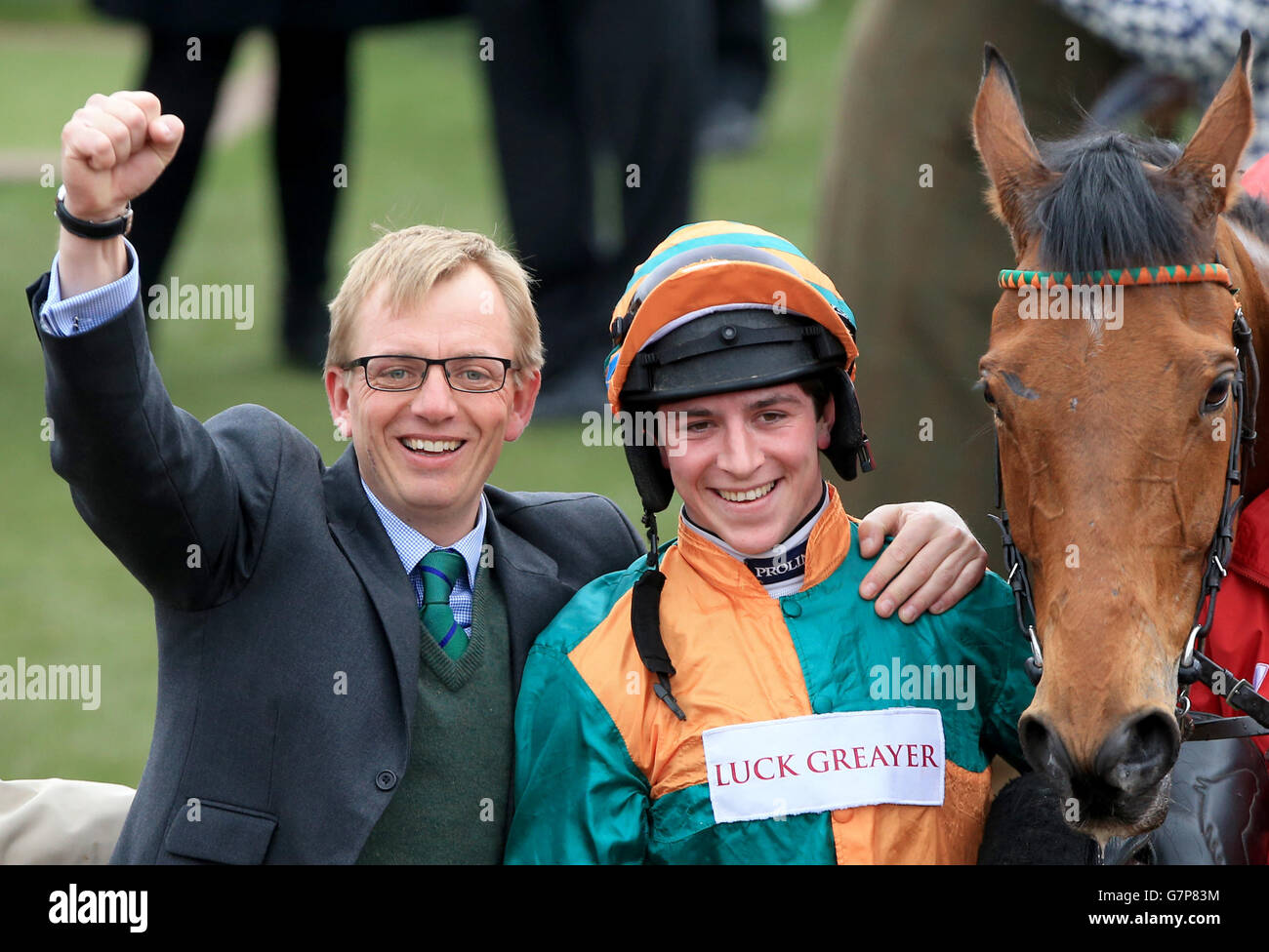 *Alternate Crop* Jockey Gavin Sheehan (right) celebrates winning the Ladbrokes World Hurdle with Cole Harden alongside trainer Warren Greatrex (left), on St Patrick's Day during the Cheltenham Festival at Cheltenham Racecourse. PRESS ASSOCIATION Photo. Picture date: Thursday March 12, 2015. See PA story RACING Cheltenham. Picture credit should read: Nick Potts/PA Wire. Stock Photo