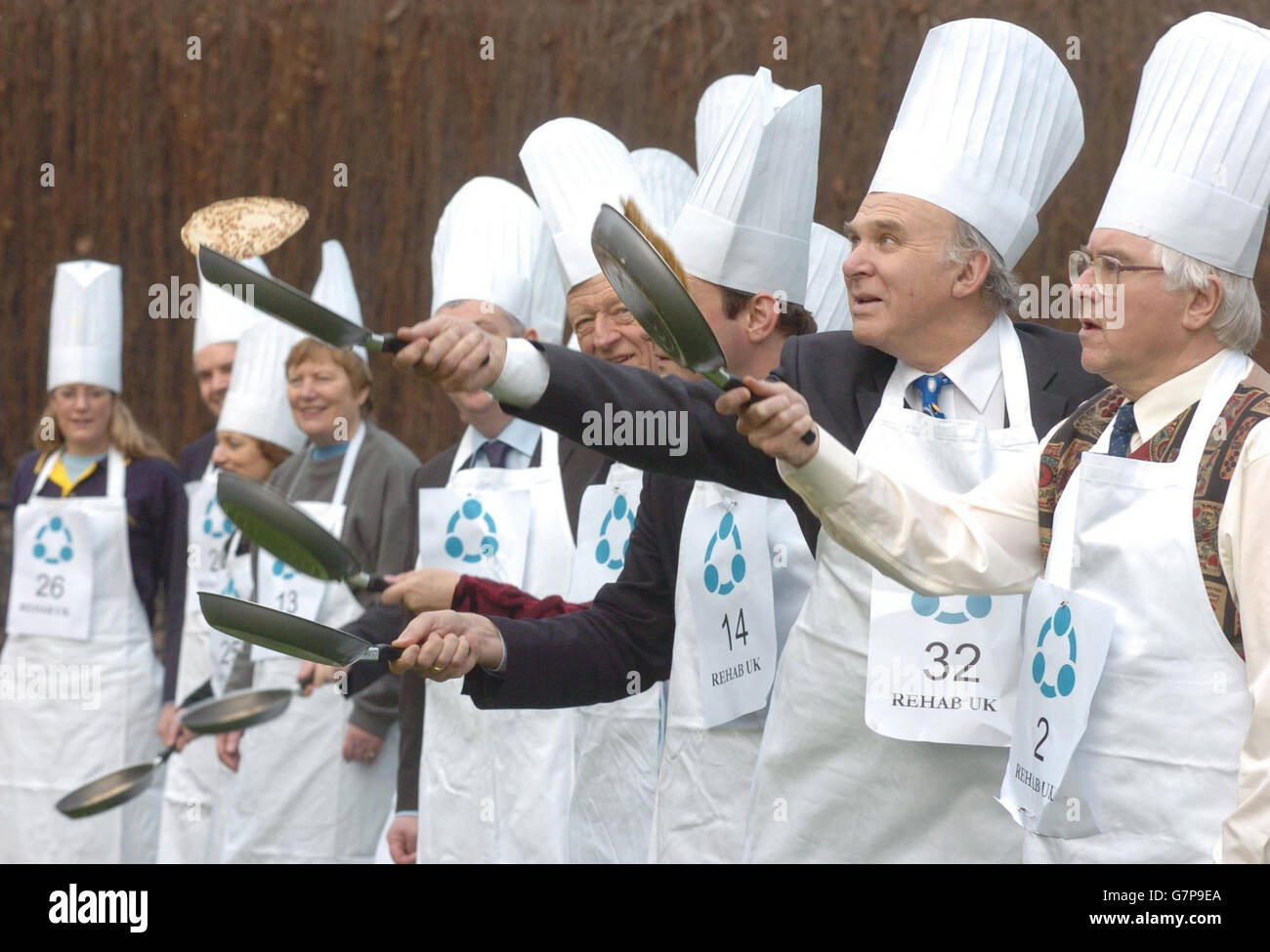 Liberal Democrat MP's Bob Russell (right), MP for Colchester, and Vince Cable (2nd right), MP for Twickenham, join other MP's and members from a wide range of constituencies as they prepare for the ninth Pancake Race between the House of Lords and the House of Commons. Stock Photo