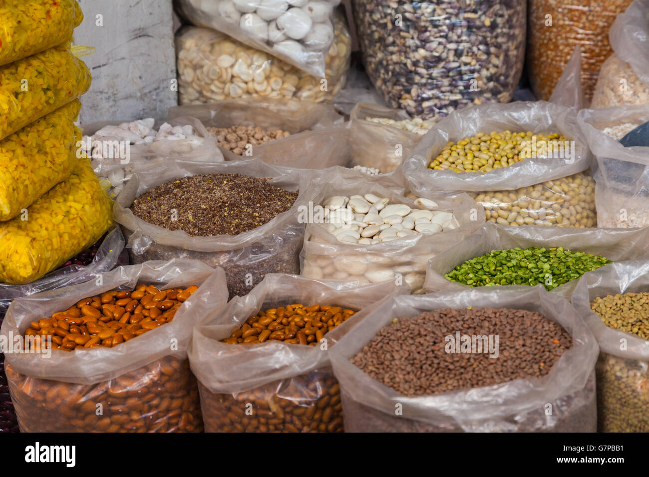 Bags of beans and seeds for sale at the San Pedro market in Cusco, Peru