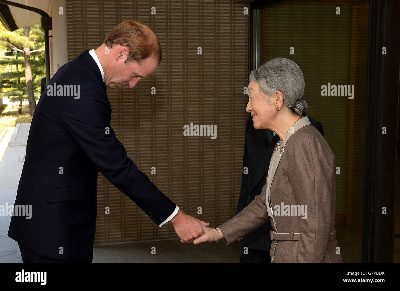The Duke of Cambridge bows as he shakes hands with Empress Michiko, after he arrived for lunch with the Emperor and his wife at the couple's residence within the Royal Palace grounds in central Tokyo, during the second day of his trip to Japan. Stock Photo