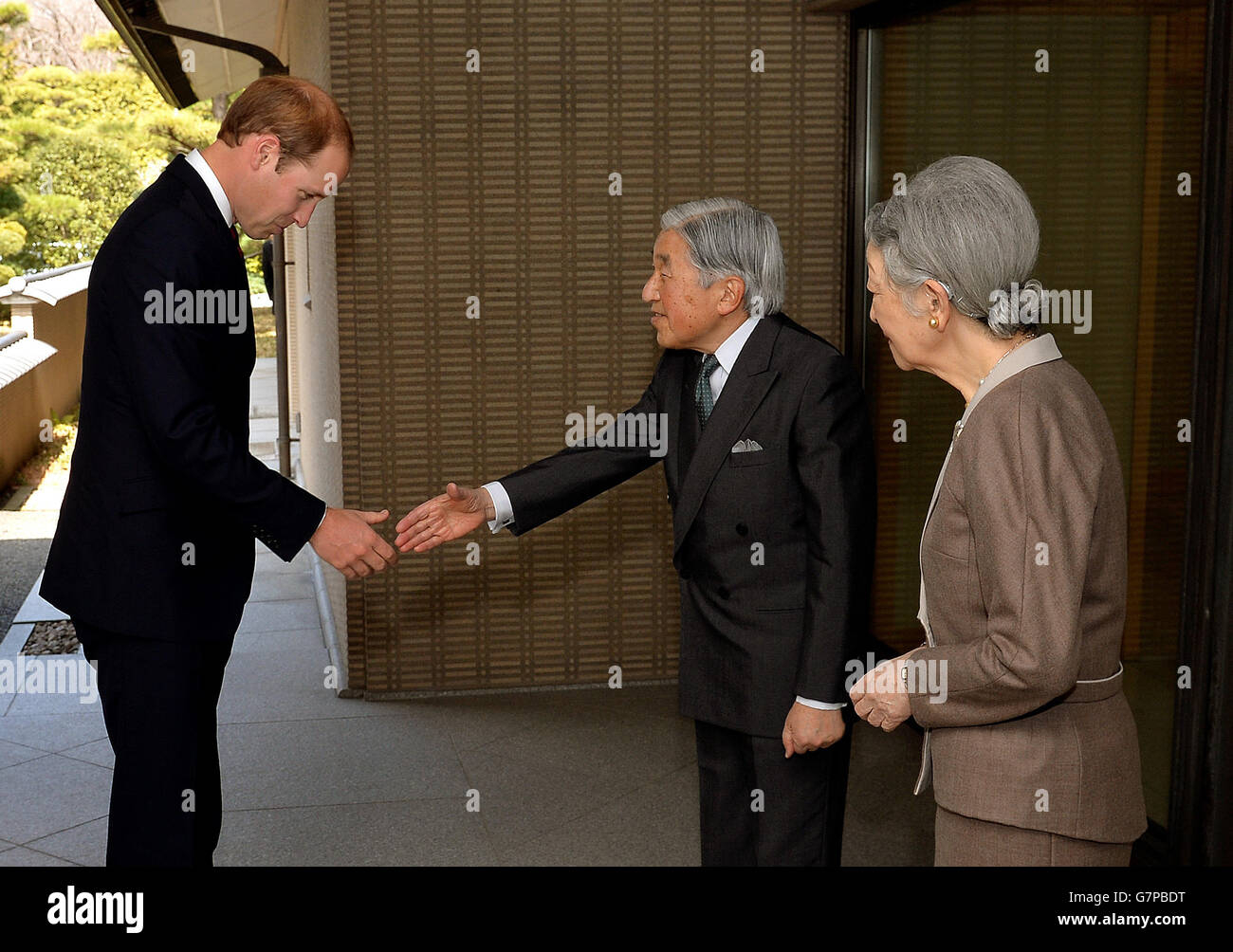 The Duke of Cambridge shakes hands with Emperor Akihito watched by Empress Michiko, after he arrived for lunch at the couple's residence within the Royal Palace grounds in central Tokyo, during the second day of his trip to Japan. Stock Photo