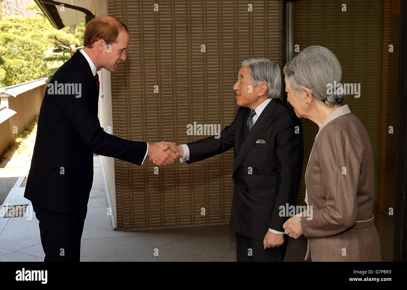 The Duke of Cambridge shakes hands with Emperor Akihito watched by Empress Michiko, after he arrived for lunch at the couple's residence within the Royal Palace grounds in central Tokyo, during the second day of his trip to Japan. Stock Photo