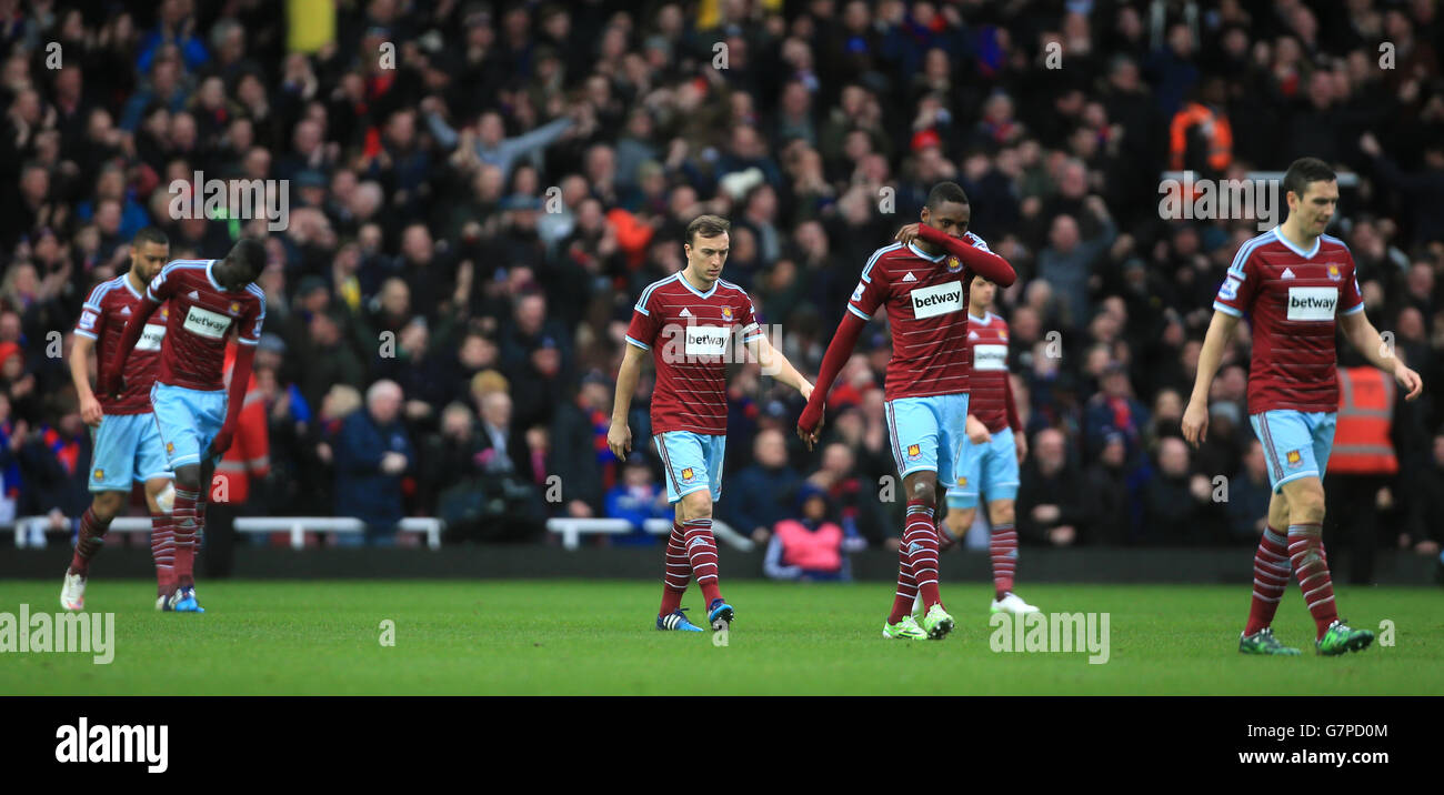 West Ham United players walk away dejected after Crystal Palace's Scott Dann scores his side's second goal of the game during the Barclays Premier League match at Upton Park, London. PRESS ASSOCIATION Photo. Picture date: Saturday February 28, 2015. See PA story SOCCER West Ham. Photo credit should read: Nick Potts/PA Wire. Stock Photo