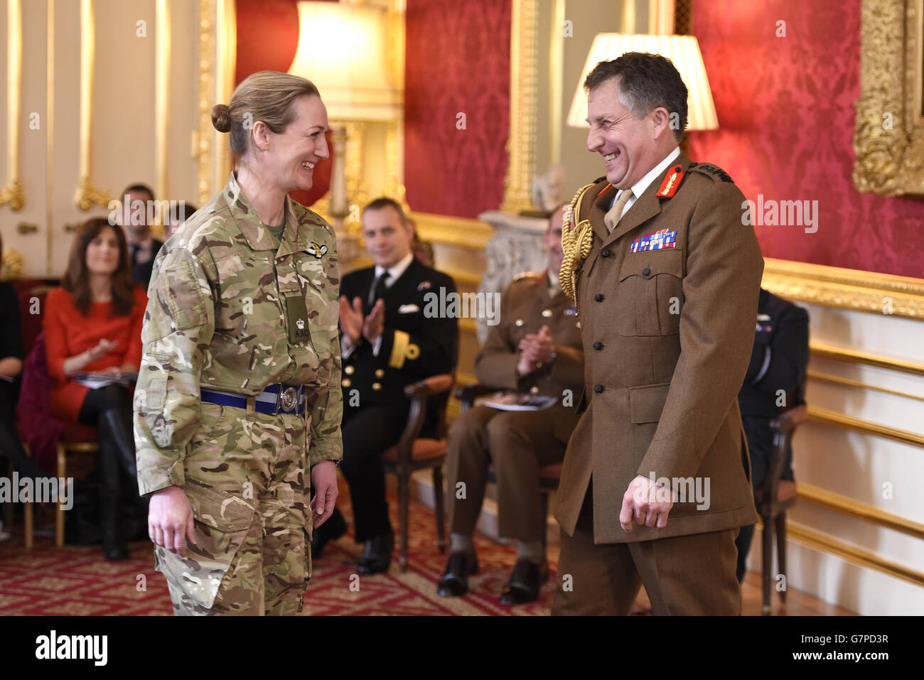 Chief of the General Staff, General Sir Nicholas Carter (right) shakes the hand of Flight Lieutenant Laura Alice Hilary Nicholson of the Royal Air Force as she is named as being awarded the Distinguished Flying Cross (DFC) during an event at Lancaster House, London where the latest Operational Honours and Awards was announced. Stock Photo
