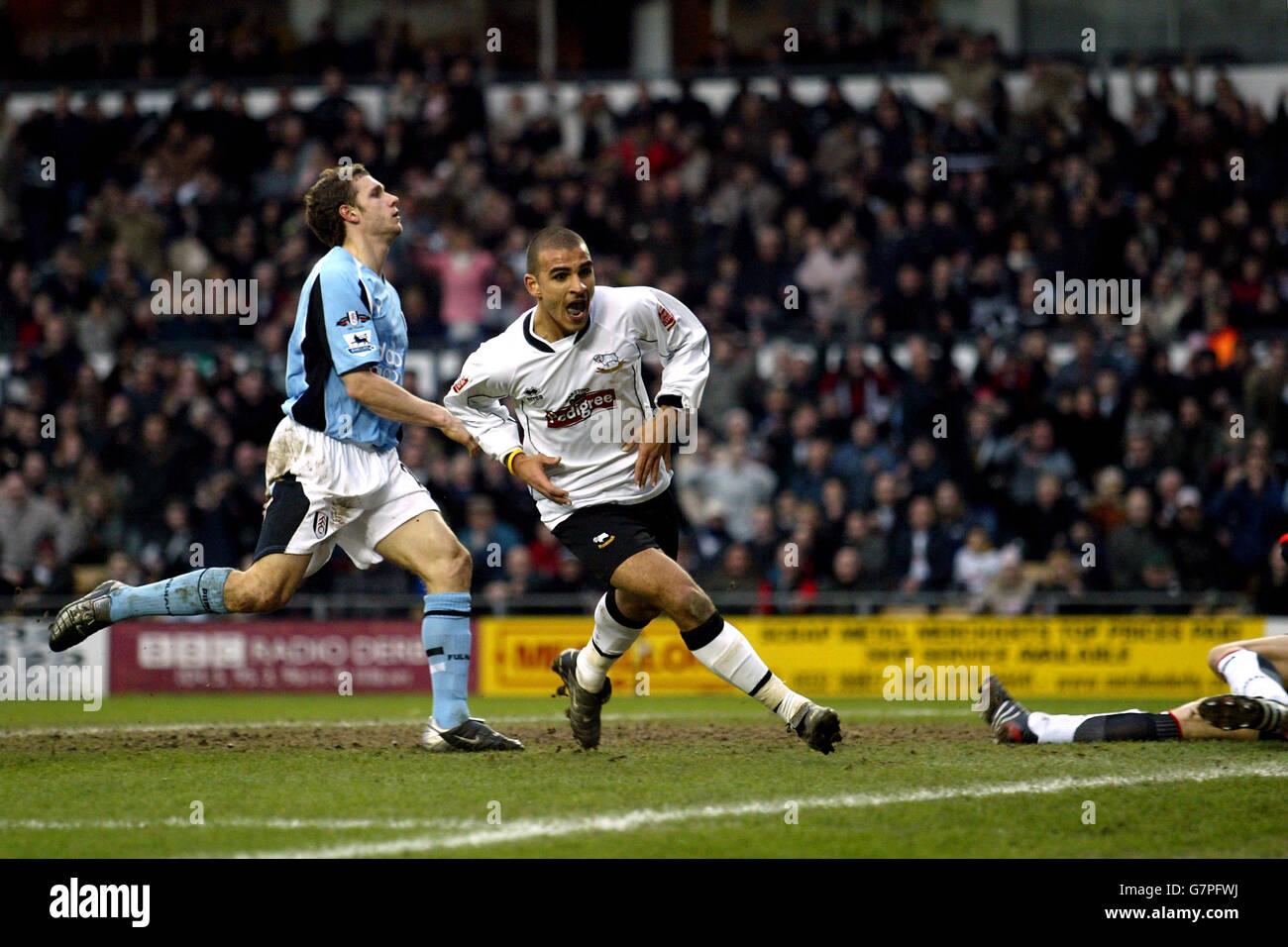 Soccer - FA Cup - Fourth Round - Derby County v Fulham - Pride Park. Derby County's Marcus Tudgay turns to celebrate his goal as Fulham's Moritz Volz stands dejected Stock Photo