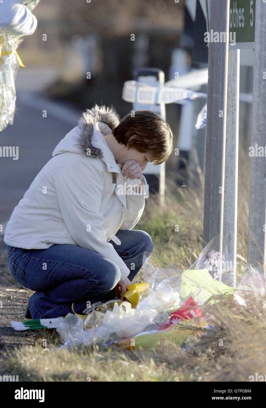 Lawson the mother of Craig Lawson lays flowers at the location on