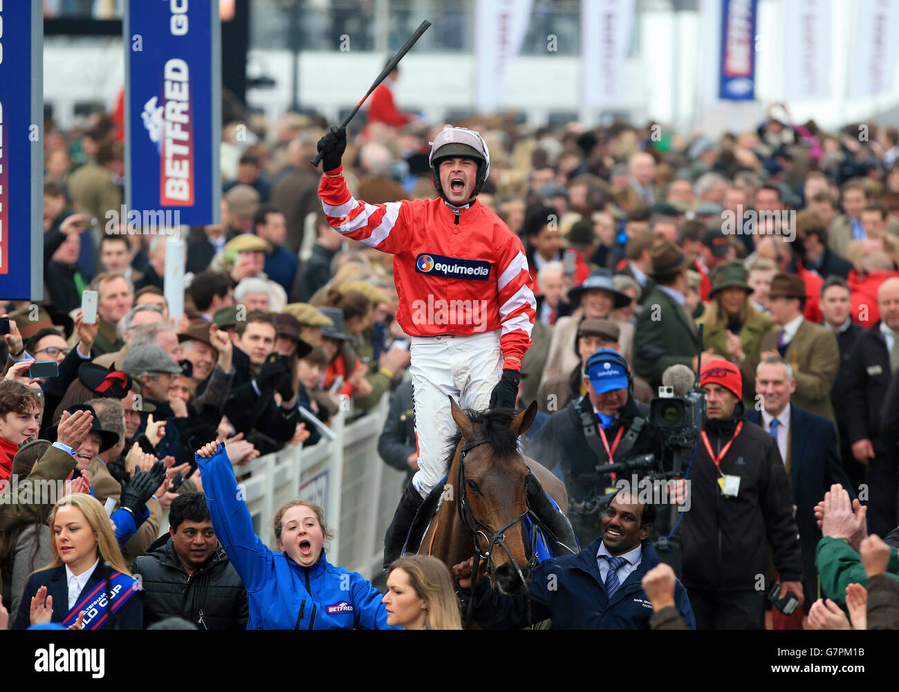 Nico de Boinville on Coneygree celebrates after winning the Betfred Cheltenham Gold Cup Chase on Gold Cup Day during the Cheltenham Festival at Cheltenham Racecourse. PRESS ASSOCIATION Photo. Picture date: Friday March 13, 2015. See PA story RACING Cheltenham. Picture credit should read: Nick Potts/PA Wire. Stock Photo