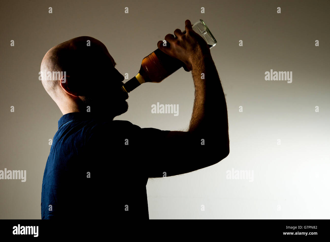 PICTURE POSED BY MODEL A man drinking alcohol. Stock Photo