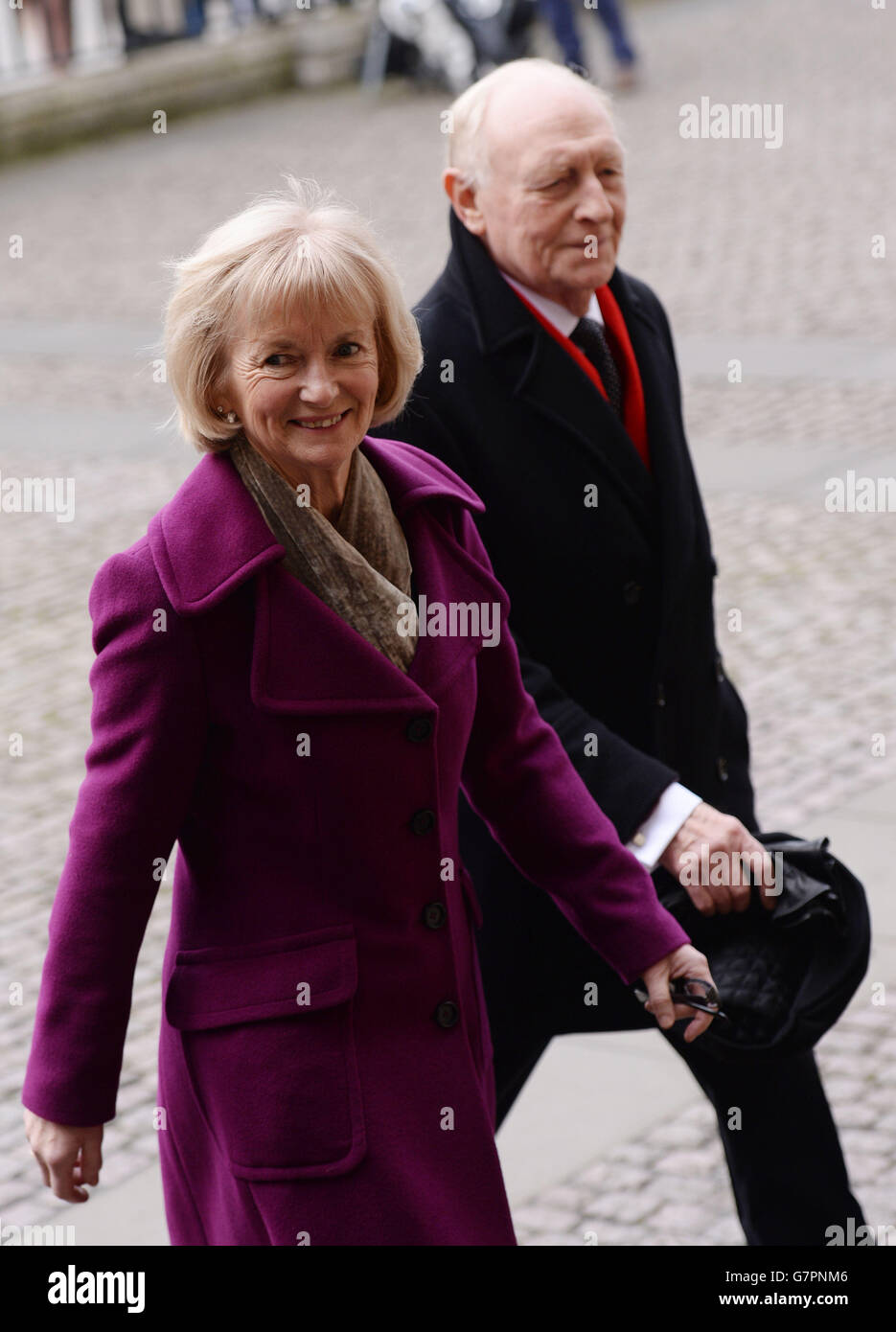 Lord Neil Kinnock and Baroness Glenys Kinnock arrive at Westminster Abbey in London for the memorial service of Lord Richard Attenborough, who died last year. Stock Photo