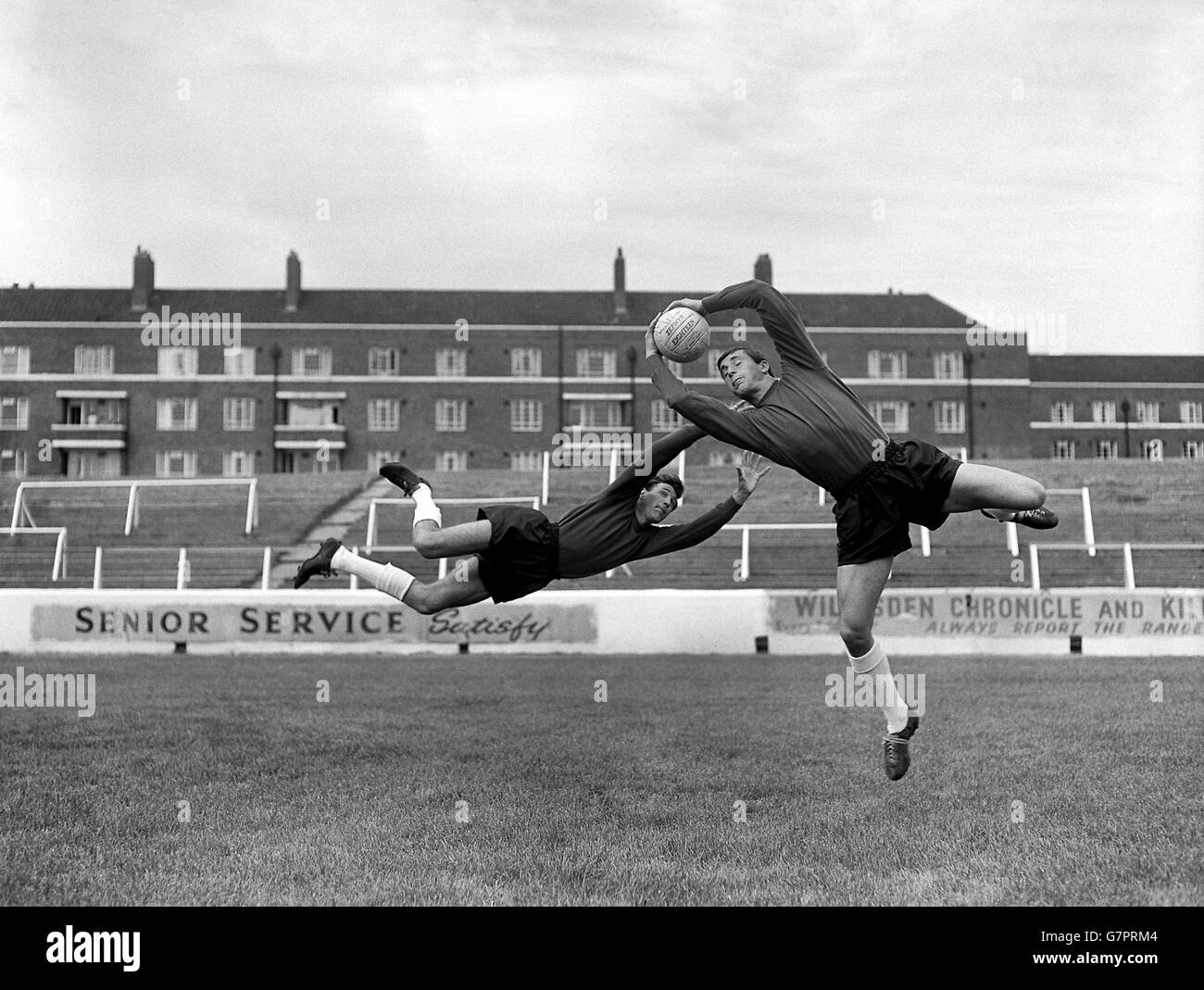 Queens Park Rangers goalkeepers Frank Smith (l) and Peter Springett (r) during pre-season training at Loftus Road. Stock Photo