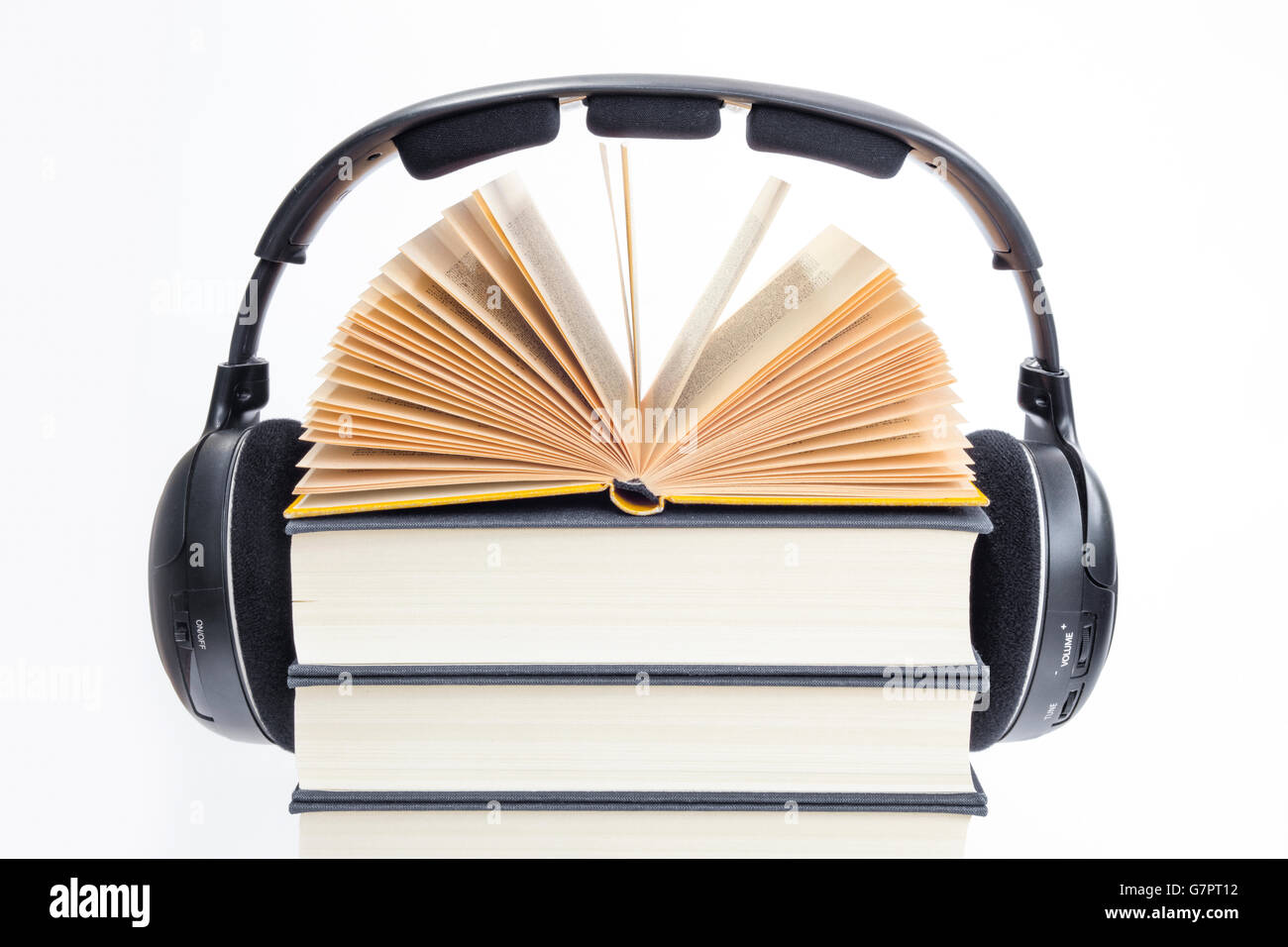 Group of books and headphones related to audiobooks, E-books and digitally listening  and storytelling of written books Stock Photo