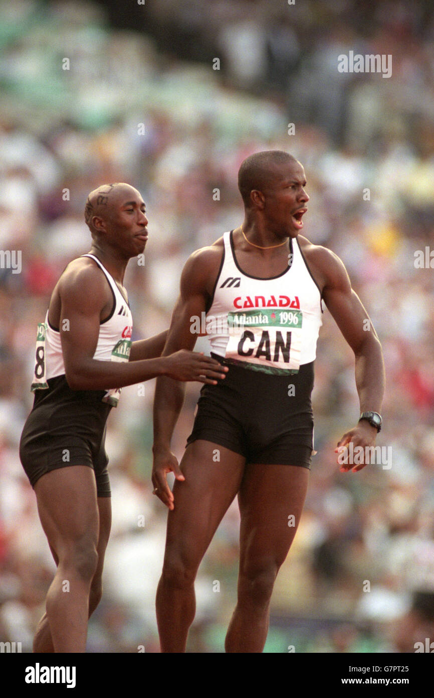 Athletics - 1996 Summer Olympics Atlanta - Men's 4x100m Relay - Final - Centennial Olympic Stadium. Canada's Donovan Bailey (r) celebrates with team-mate Robert Esmie. Stock Photo