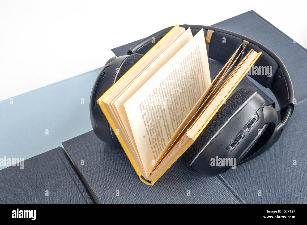 Group of colorful books and headphones related to audiobooks, E-books and digitally listening conversations and storytelling of Stock Photo