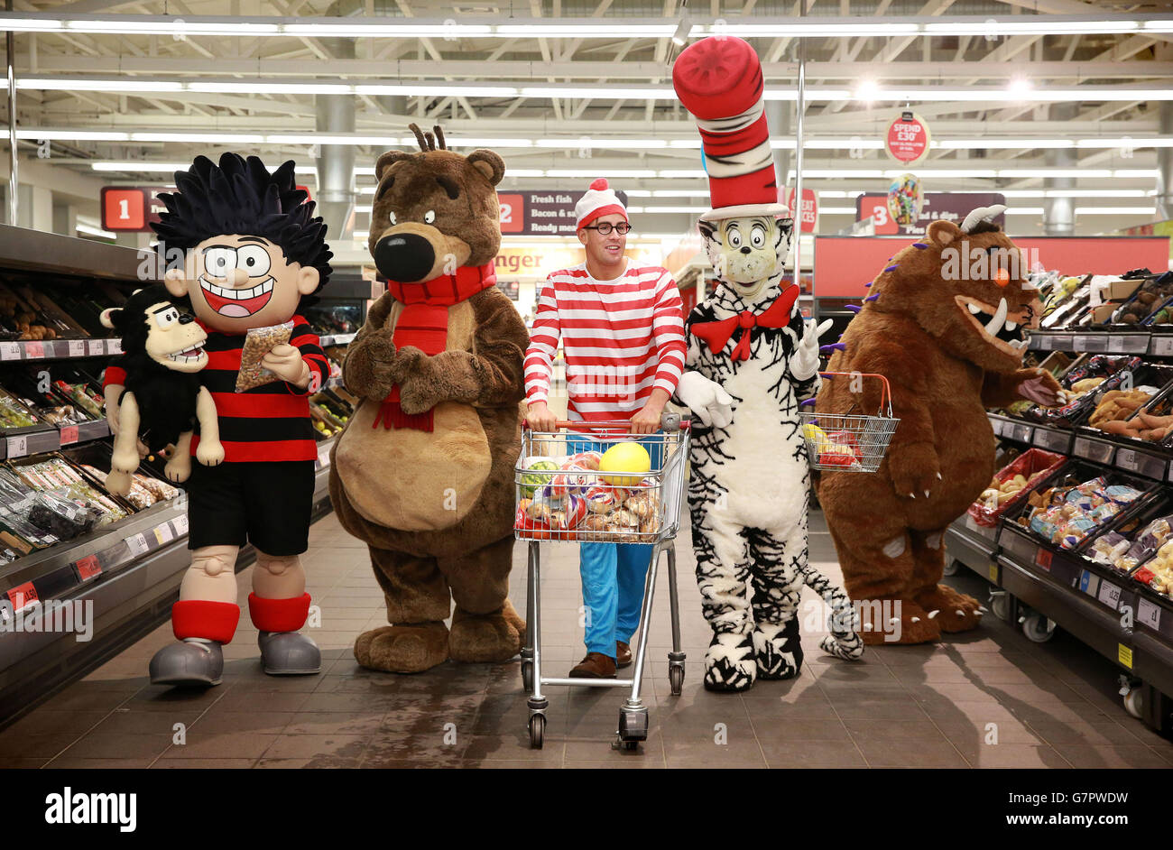 Well-known storybook characters (left to right) Dennis the Menace, Hugless Douglas, Where's Wally, Cat in the Hat and The Gruffalo visit the Sainsbury's store in Wandsworth, south west London, ahead of World Book Day, which is on Thursday 5 March. Stock Photo