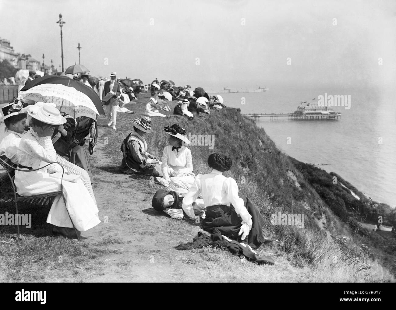 People relax on the cliff tops during their annual holiday at Folkestone Stock Photo