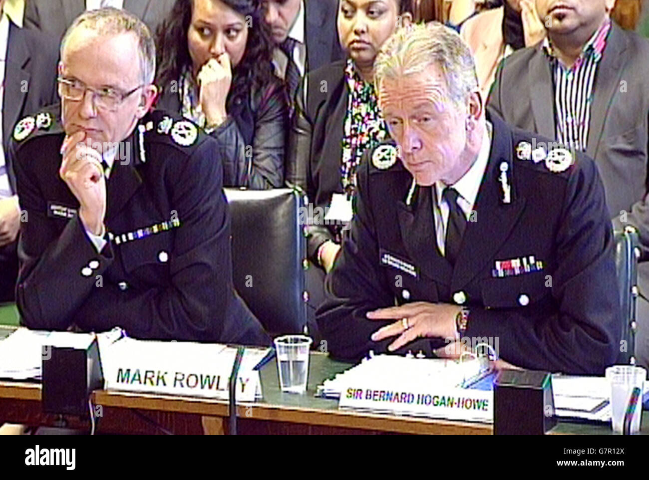 Mark Rowley (left) Assistant Commissioner and Sir Bernard Hogan-Howe, Metropolitan Police Commissioner give evidence to the Home Affairs Select Committee in the House of Commons, London, where the head of Scotland Yard has apologised for failing to communicate more directly with the families of three teenage girls who are feared to have travelled to Syria to join Islamic State (IS) - but has insisted there was nothing more the force could have done to stop them from leaving. Stock Photo