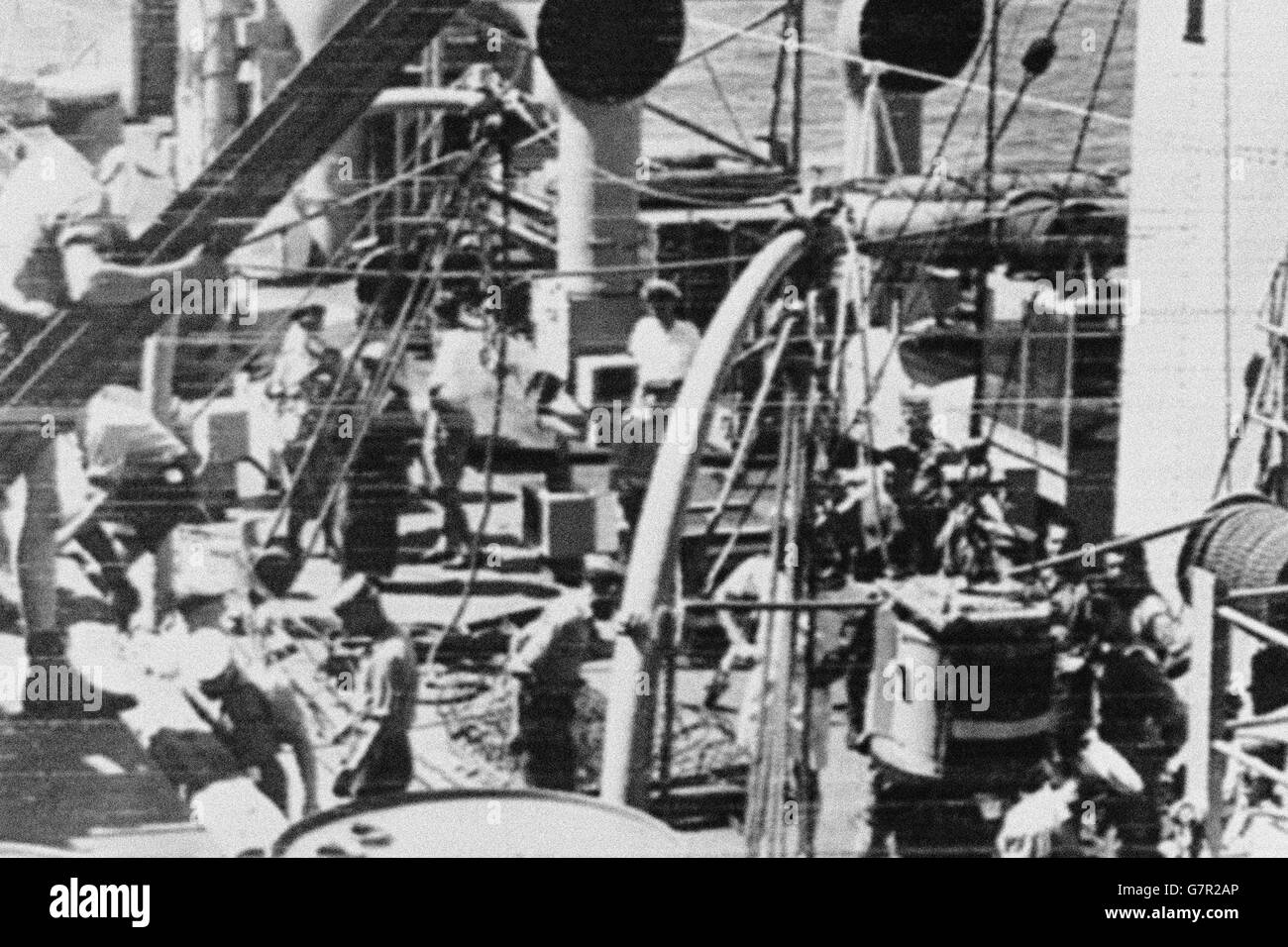 Technical equipment used during the test of the British atomic weapon in the Monte Bello Islands being unloaded from the Australian frigate Hawkesbury after her arrival at Onslow, nearest Australian mainland town to the the scene of the explosion. When they reached Onslow the crew of the Hawkesbury were wearing white squares which would react to radioactivity by changing colour. Stock Photo