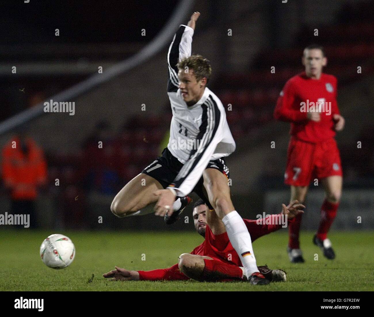 Soccer - UEFA Under 21 Championship - Qualifying Round - Wales v Germany - Racecourse Ground. Wales' Craig Morgan and Germany's Marcell Jansen battle for the ball Stock Photo