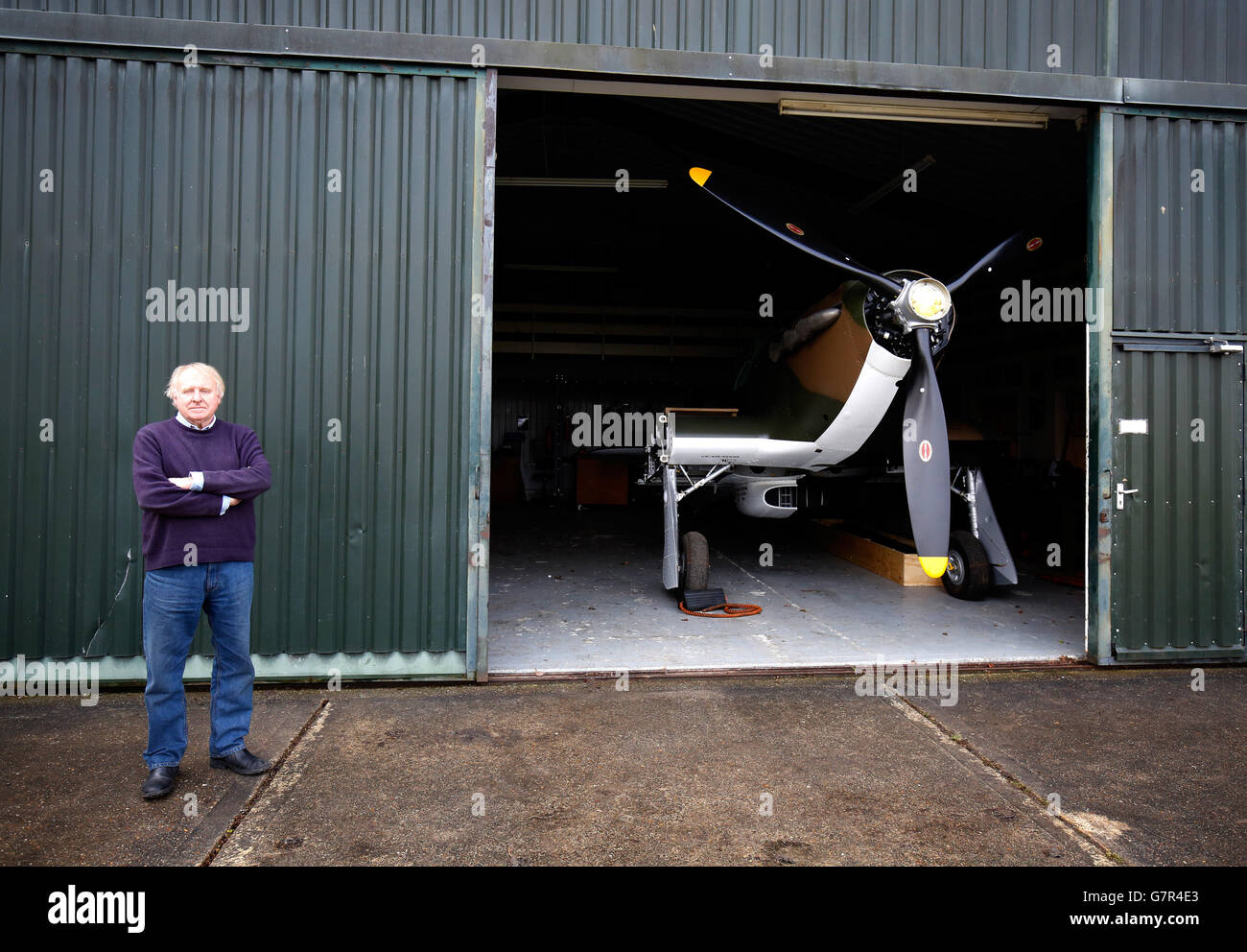 Previously unissued photo dated 18/03/15 of Tony Eitheridge from Hawker Restorations Ltd next to a Hawker Hurricane Mk 1 in his Suffolk workshop, as the plane which was shot down in September 1940, is undergoing a full restoration to coincide with the 75th anniversary of the Battle of Britain this year. Stock Photo