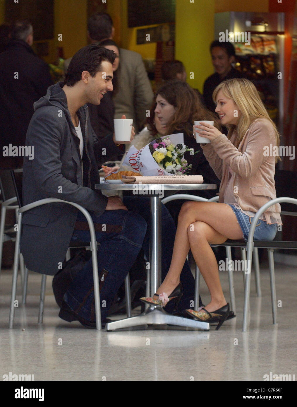 Singer Darius Danesh and Coronation Street actress Tina O'Brien meet for a coffee at Waterloo Station, after learning they have been awarded honours by 1.5 million singles with on-line dating company Udate.co.uk. Tina, who plays the character Sarah Louise Platt, was voted 'Nation's Sweetheart' and former Pop Idol finalist Darius received the honour of 'Tempter'. Stock Photo