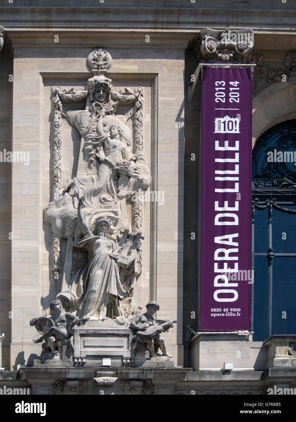 LILLE, FRANCE - JUNE 08, 2014:  Architectural detail on the Opera House (Opera de Lille) with banner sign Stock Photo