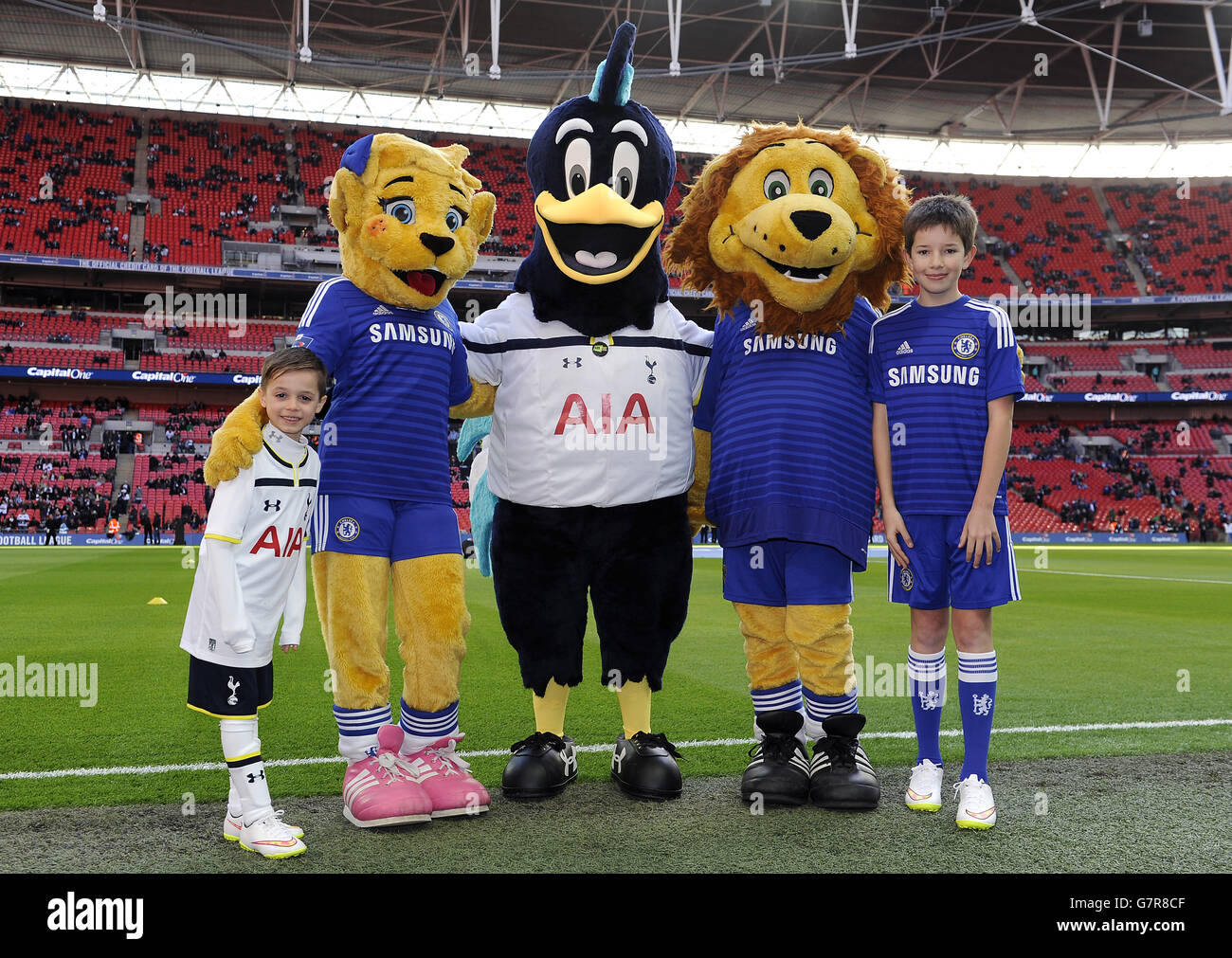 Tottenham Hotspur club mascot Chirpy Cockerel (centre) and the Chelsea mascots Stamford the Lion (right) and Bridgett the Lioness (left) with the two match day mascots. Stock Photo