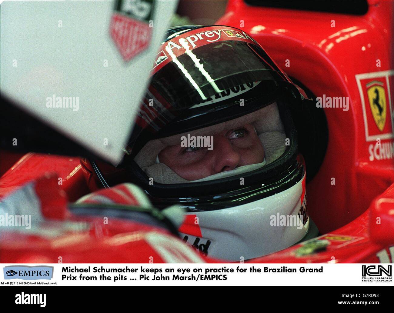 Michael Schumacher keeps an eye on practice for the Brazilian Grand