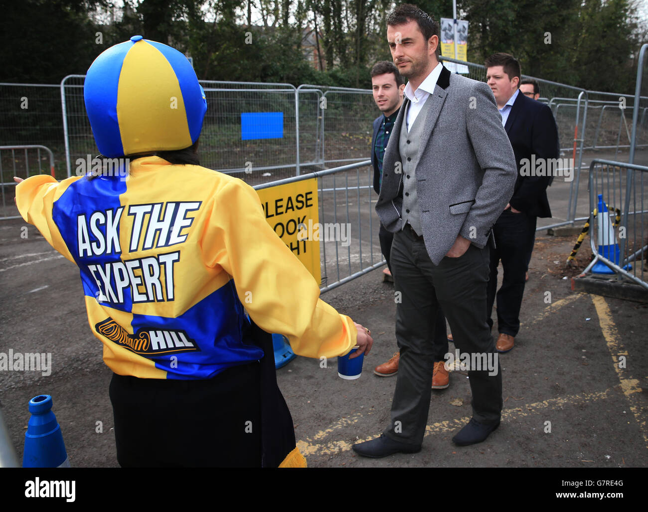 William Hill outside Cheltenham Spa train station directing racegoers to Cheltenham races, on St