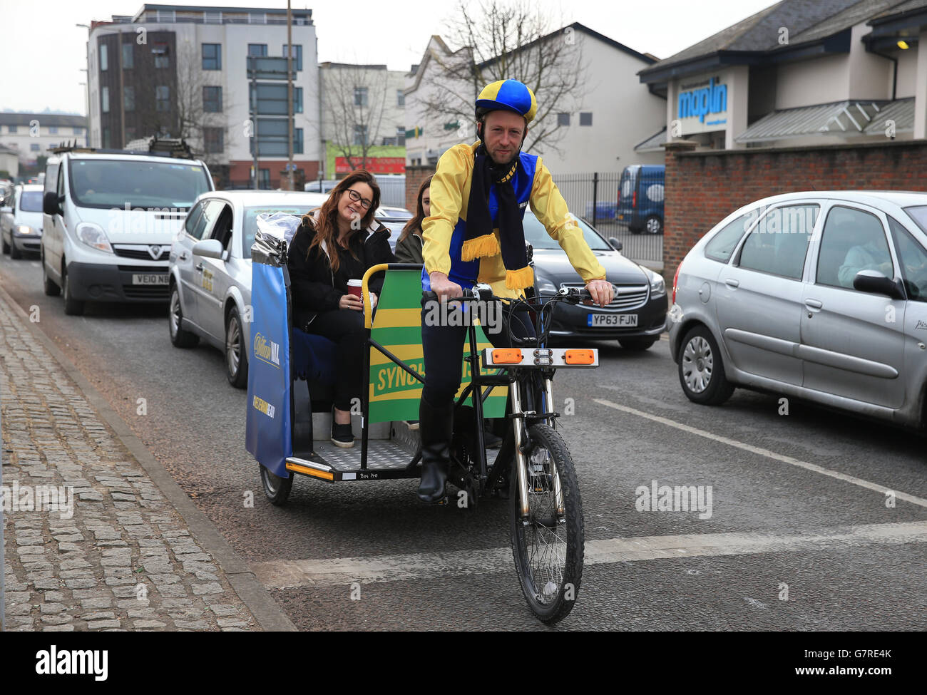 William Hill push bike taxi in Cheltenham town centre , on St Patrick's Day during the
