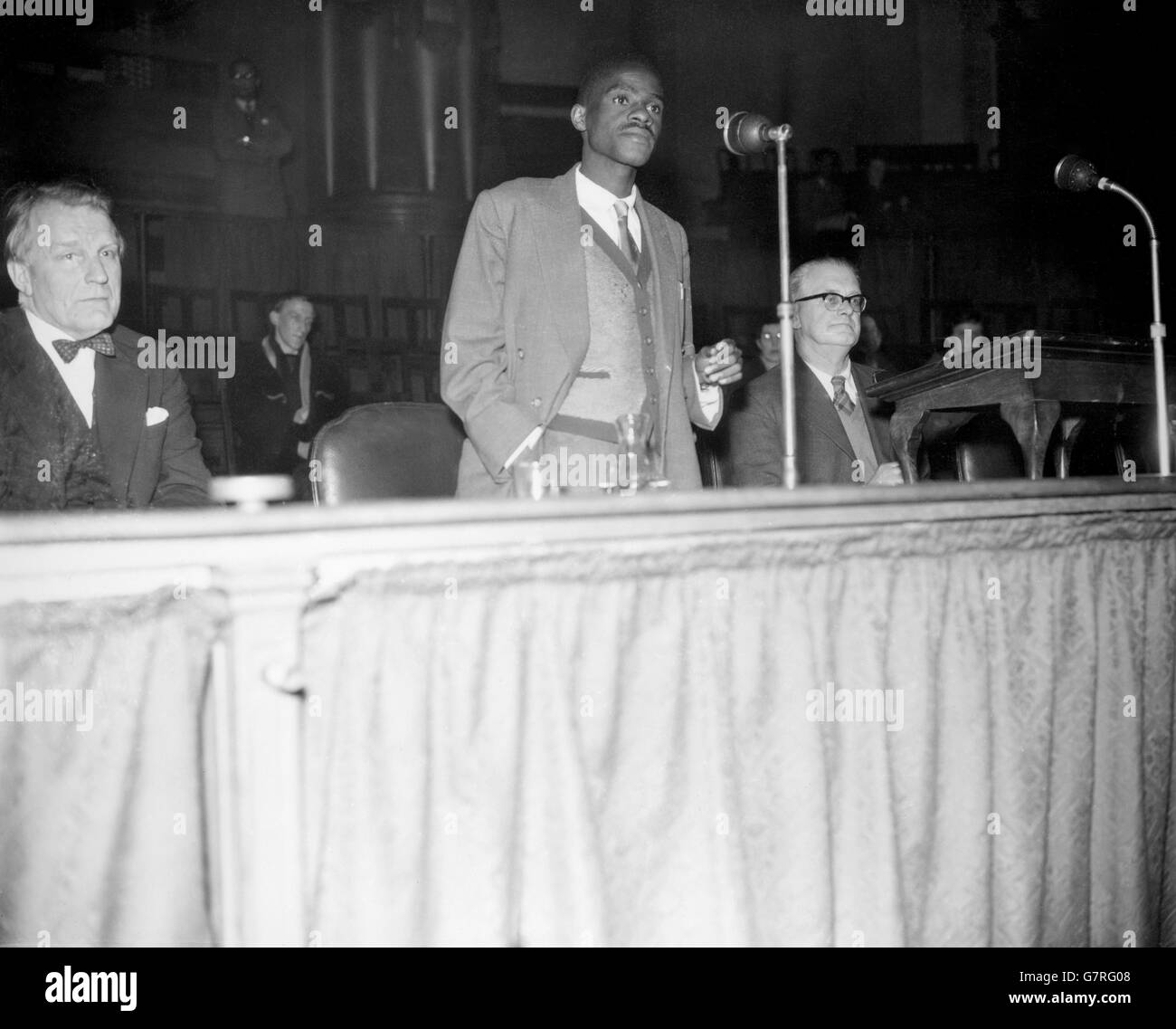 Kanyama Chiume (right) speaking at a meeting for the Movement for Colonial Freedom and Committee for African Organisations Meeting at Central Hall, Westminster, London. Kanyama Chiume is the 29 year old member of the Nyasaland Legislative Council and publicity secretary of the Nyasaland African Congress. The meeting was called to support African demands for the ending of the Central African Federation and full independence for Nyasaland and Northern Rhodesia. Stock Photo