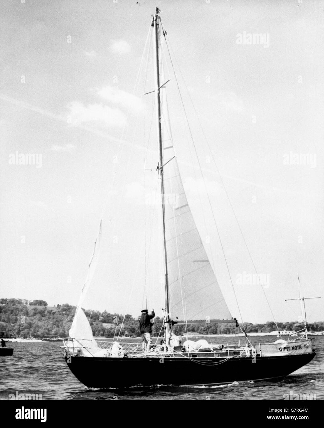 Francis Chichester sets sail in his yawl Gipsy Moth III from Plymouth for his second singlehanded crossing of the Atlantic. Two years ago, sailing this same craft, he won the first singlehanded trans-Atlantic race. This time he hopes to make the crossing inside 30 days. Mr Chichester will carry a radio transmitter and will be in touch with Britain throughout the crossing. He was chief navigation instructor at the RAF Central Flying School in the last war. Stock Photo