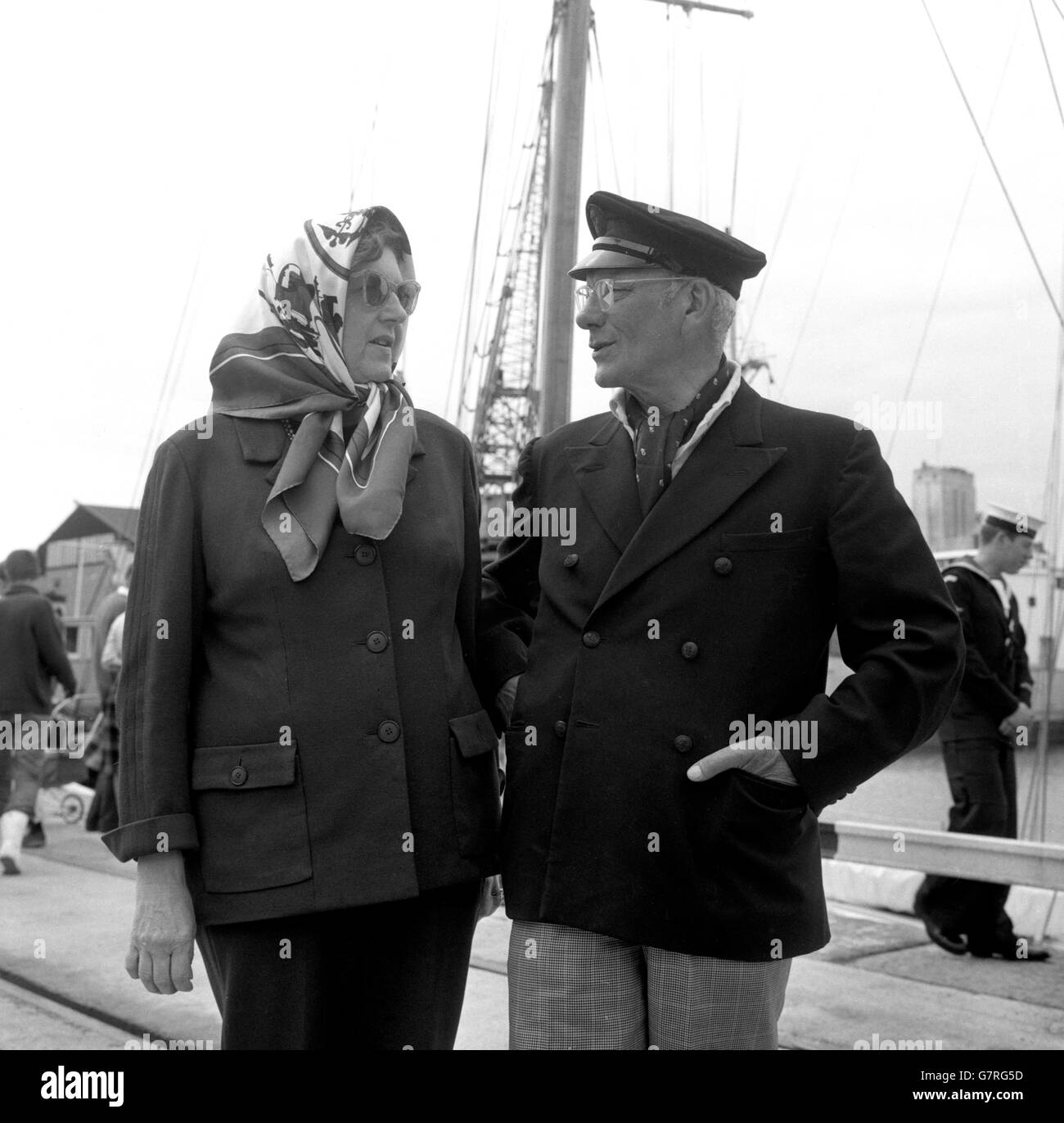 Francis Chichester, 63 year old map publisher of St. Jame's Place, London, with his wife at Plymouth where he sails in his 13 ton cutter Gipsy Moth III for the second singlehanded transatlantic race, an event that has been called the loneliest race in the world. Destination of competitors for The Observer trophy is Newport, Rhode Island. Francis Chichester wad the winner of the first race in 1960. In 1962 he made a lone East-West passage in the record time of 33 days, 15 hours and 7 minutes. Stock Photo