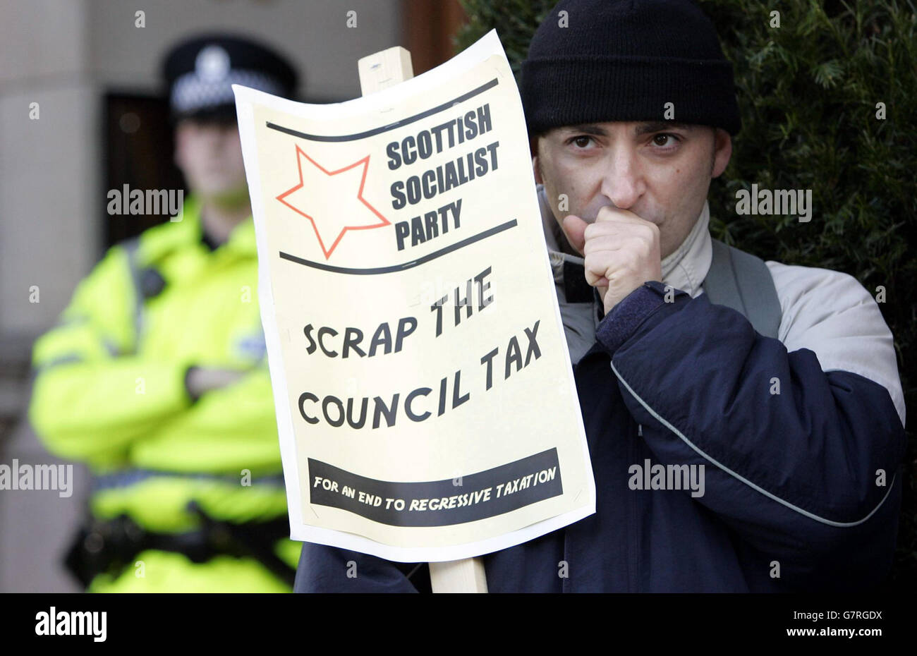 A demonstrator with the Scottish Socialist Party demonstrates outside the City Chambers. Stock Photo