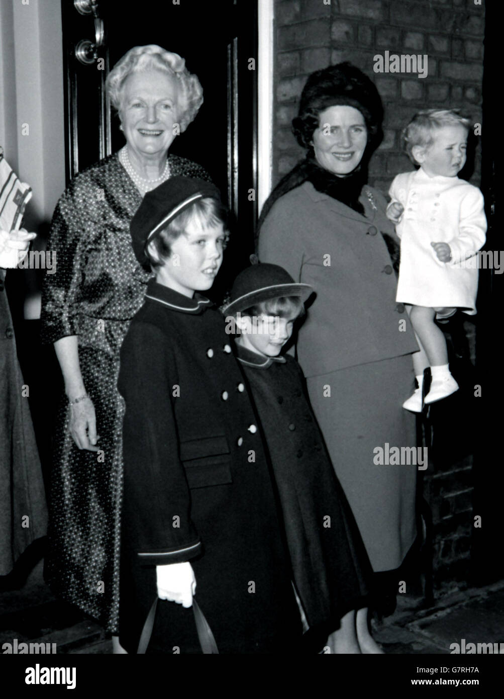 Lady Churchill (left) looks on happily as she bids farewell to her daughter Mrs Mary Soames, grandchildren Rupert Christohper, 1, Emma, 9, and Charlotte, 4, as they left after a visit to Sir Winston. Stock Photo