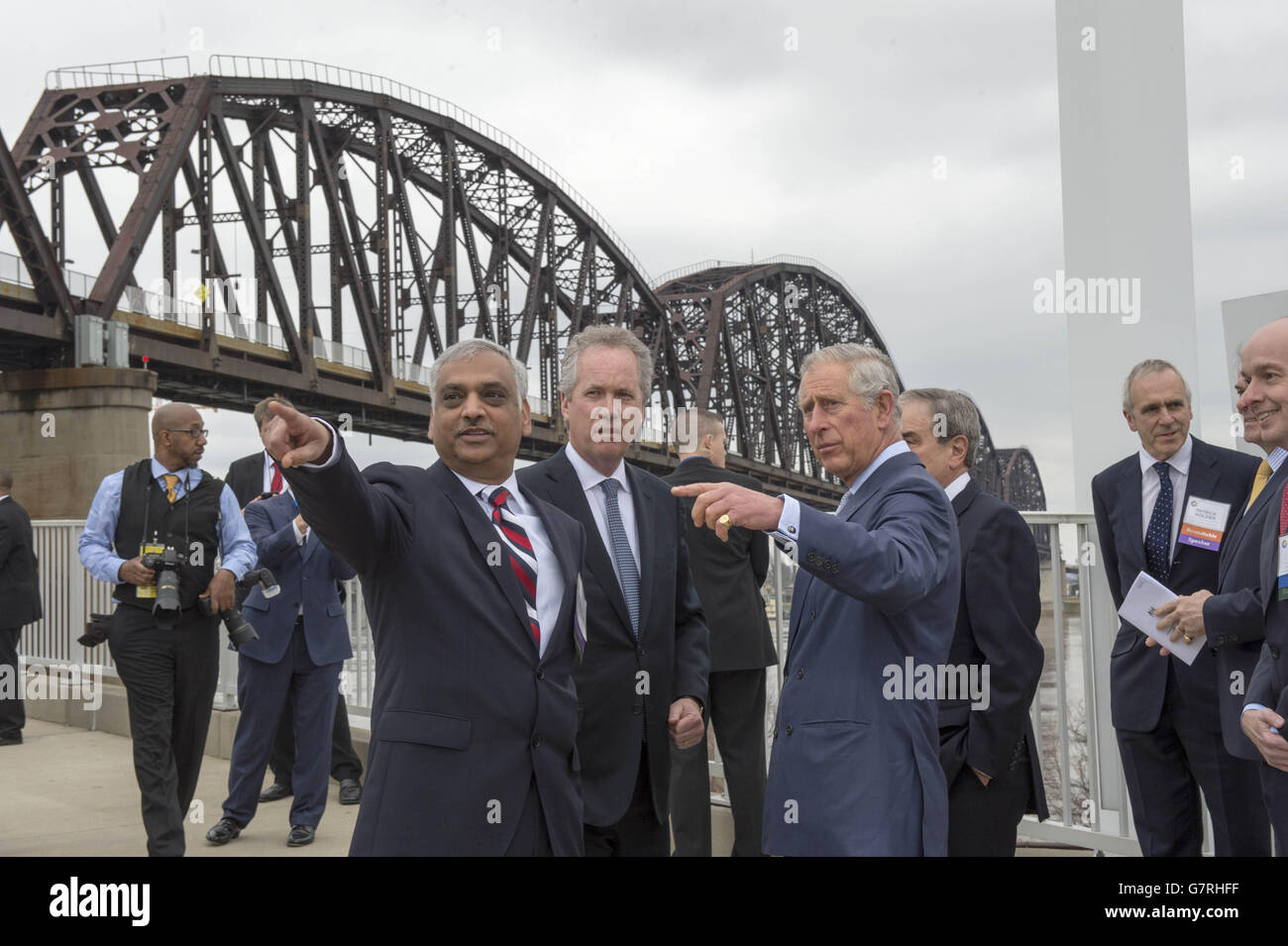 The Prince of Wales talks with the Mayor of Louisville, Kentucky, Greg Fischer (centre) and Dr. Aruni Bhatnagar (front left) from the University of Louisville Department of Medicine at the Big Four Bridge in Louisville, Kentucky. PRESS ASSOCIATION Photo. Picture date: Friday March 20, 2015. See PA story ROYAL Charles. Photo credit should read: Arthur Edwards/The Sun/PA Wire Stock Photo