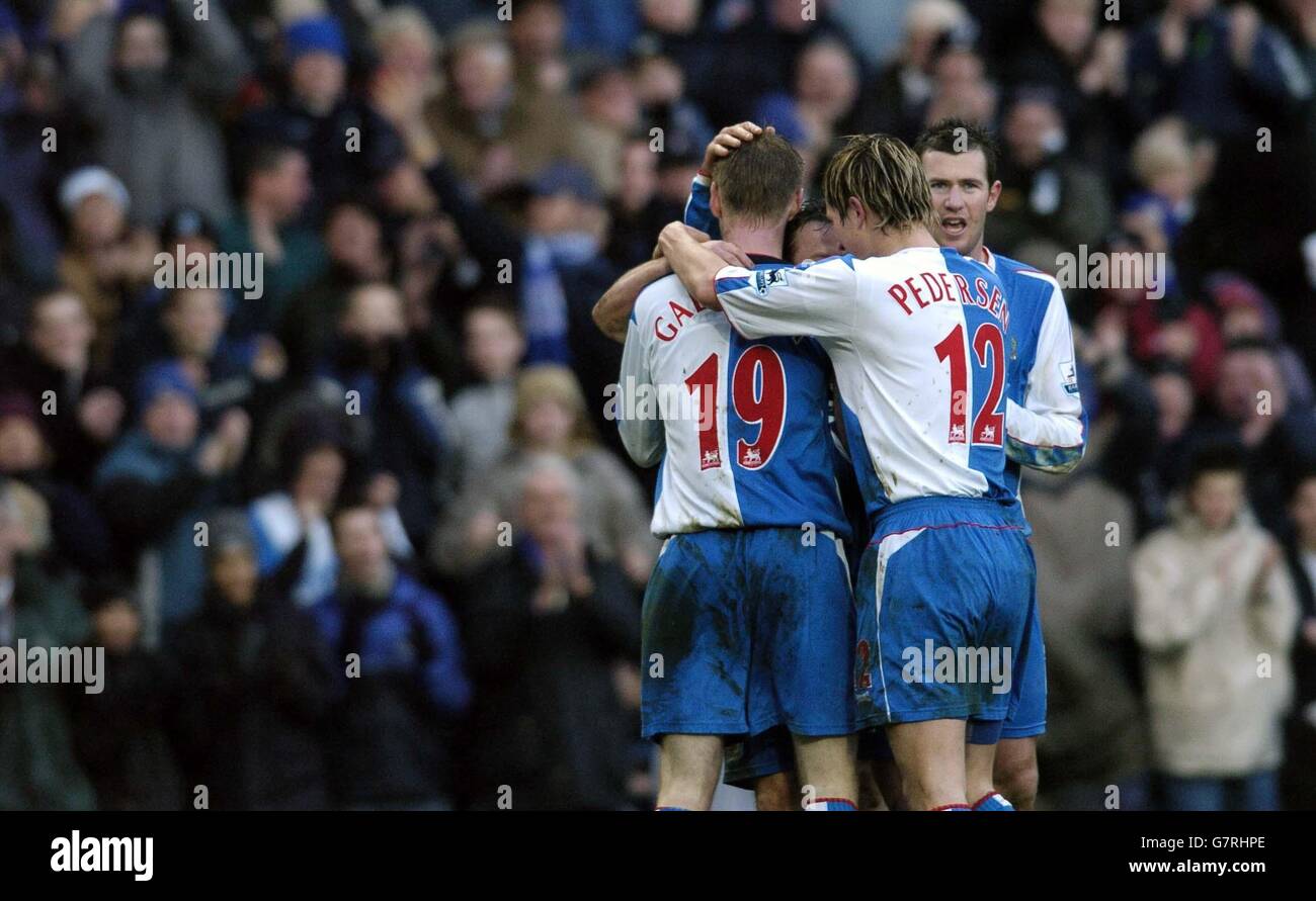 Soccer - FA Barclays Premiership - Blackburn Rovers v Norwich City - Ewood Park. Paul Dickov is swamped by his team mates after scoring his second goal Stock Photo