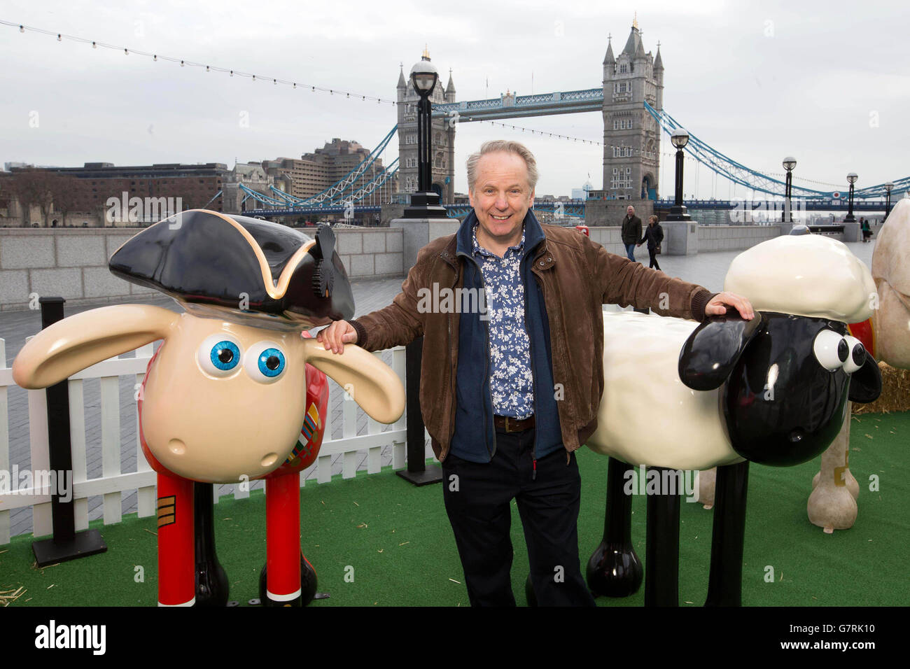 Nick Park, creator of Wallace and Gromit, stands among a flock of Shaun