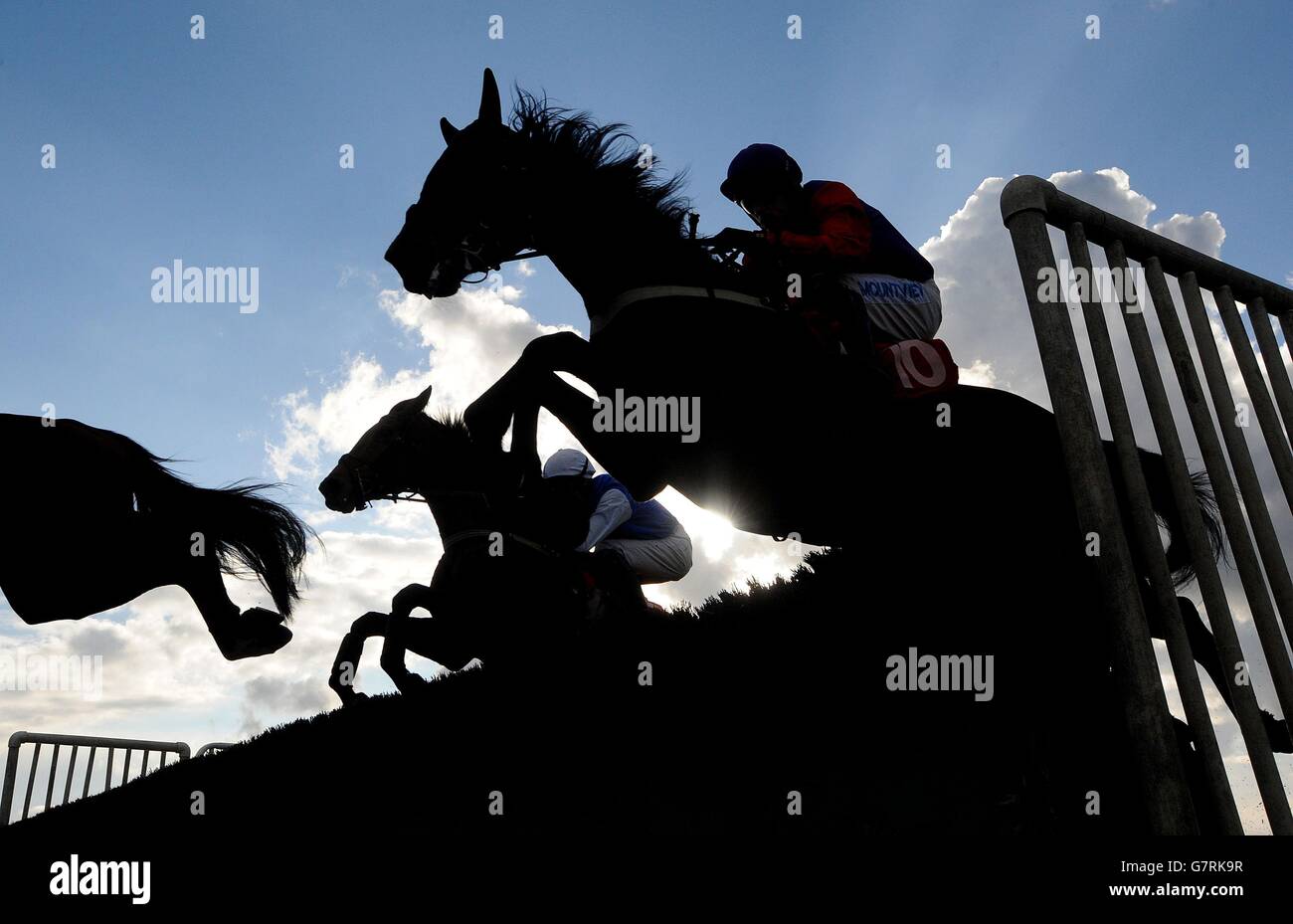 Horse Racing Southwell Racecourse. Horses clear a fence during the