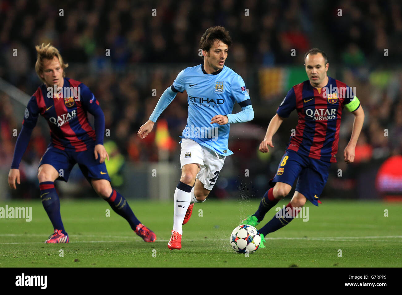 Soccer - UEFA Champions League - Round of 16 - Second Leg - Barcelona v Manchester City - Camp Nou. Manchester City's David Silva takes on Barcelona's Ivan Rakitic (left) and Andres Iniesta (right) Stock Photo