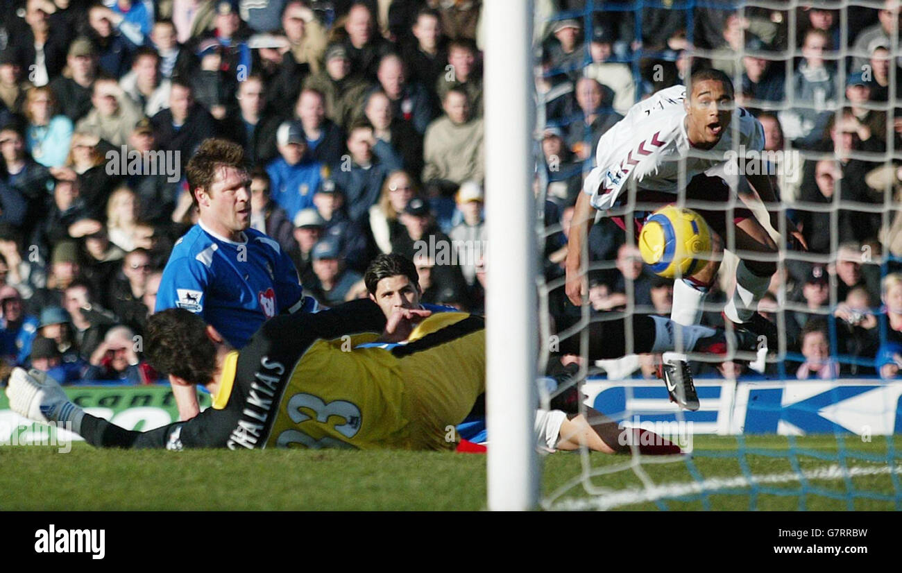 Aston Villa's Luke Moore (right) looks on as Portsmouth's Arjan De Zeeuw (unidentified) scores an own goal Stock Photo