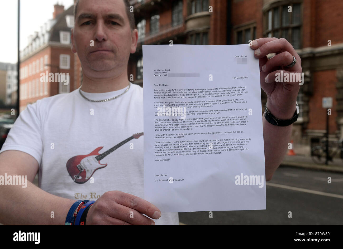PIXELATED BY PA PICTURE DESK Dean Archer poses with a letter demanding an apology from Conservative party chairman Grant Shapps, outside Millbank television studios, London. Stock Photo